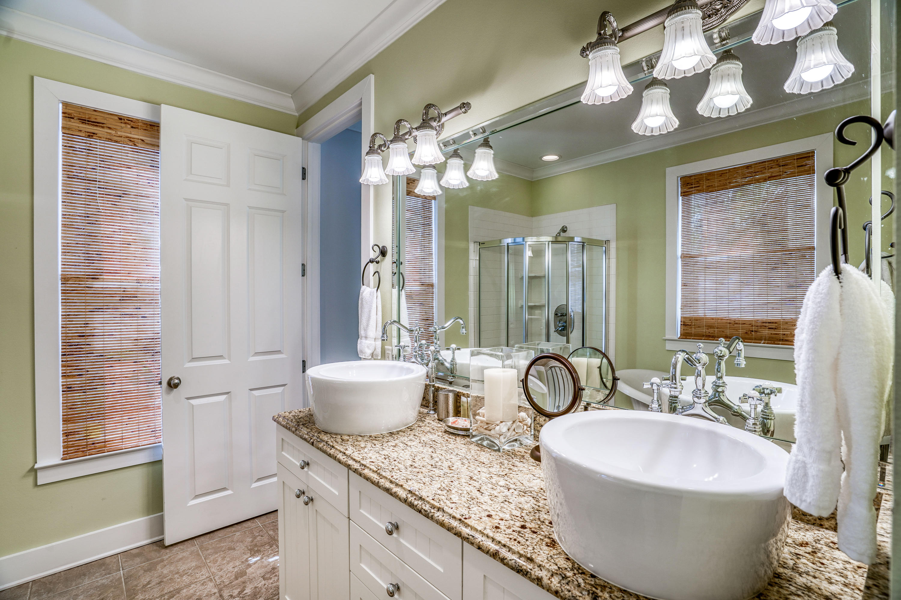 43 Lifeguard Loop East Inlet Beach, FL 32461 - Photo 16 of 44 a spacious bathroom with a granite countertop sink and a mirror