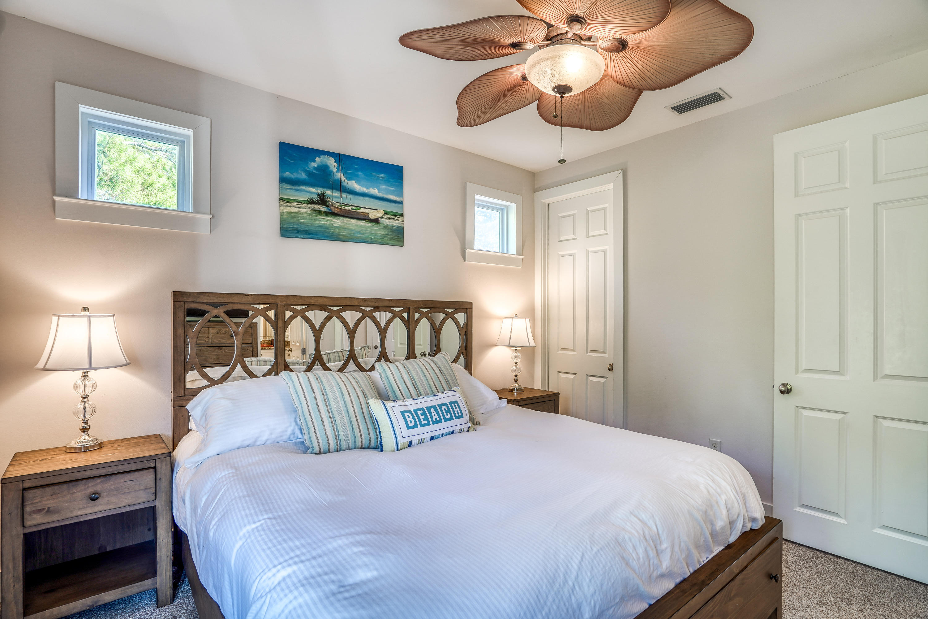 43 Lifeguard Loop East Inlet Beach, FL 32461 - Photo 27 of 44 a bedroom with a large bed and a chandelier
