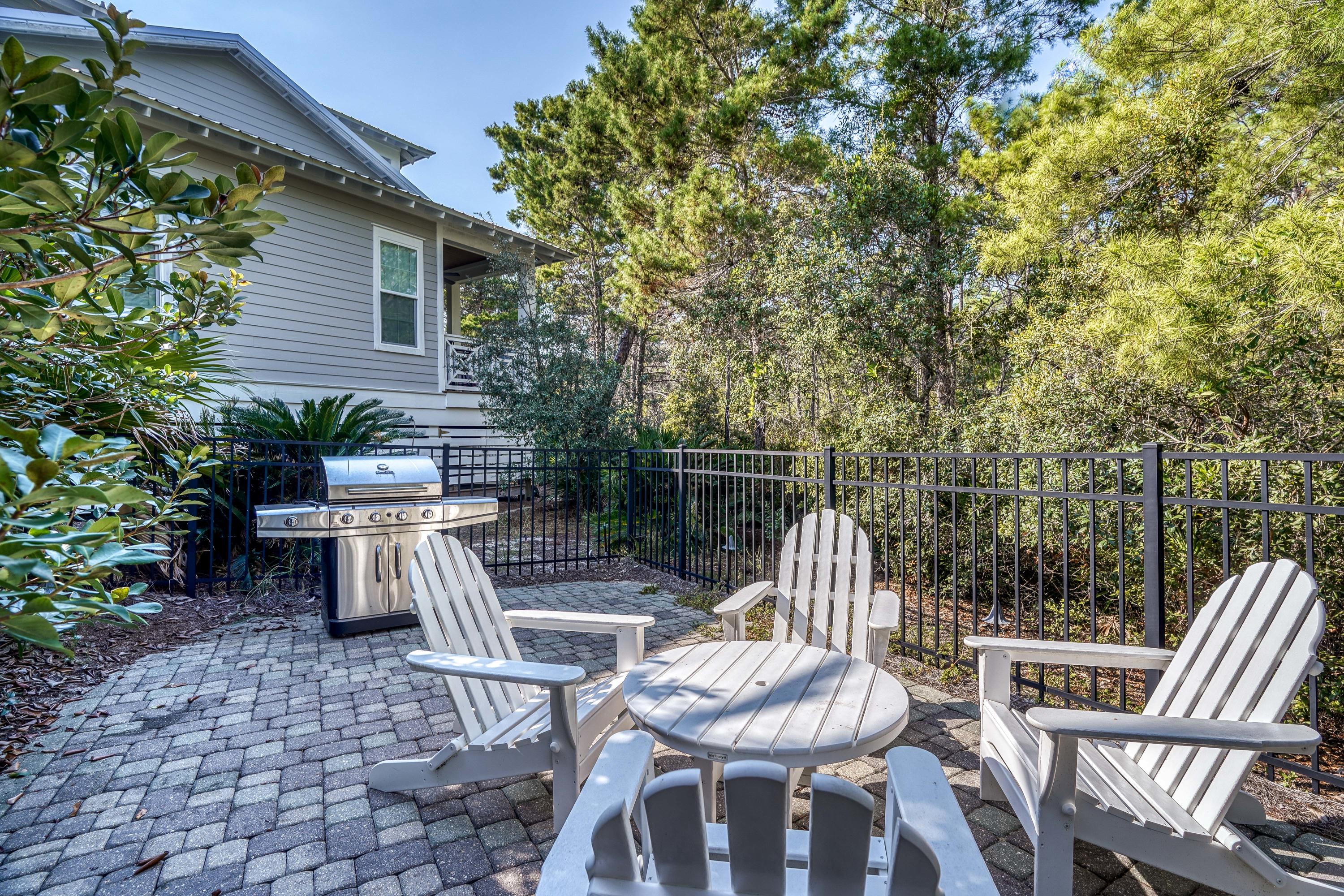 43 Lifeguard Loop East Inlet Beach, FL 32461 - Photo 35 of 44 a view of backyard with table and chairs couches with wooden fence and plants