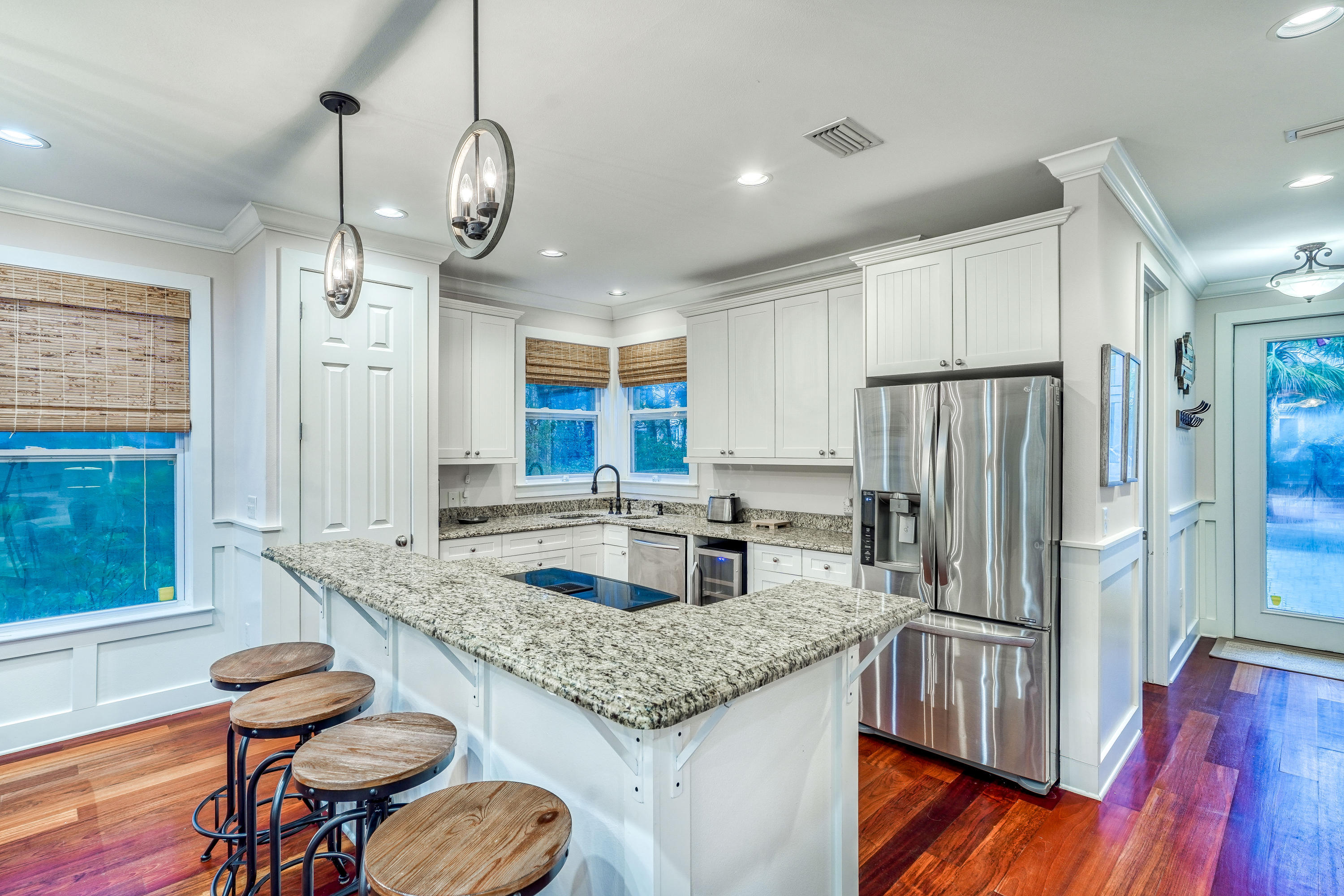 43 Lifeguard Loop East Inlet Beach, FL 32461 - Photo 8 of 44 a kitchen with stainless steel appliances granite countertop a sink refrigerator and cabinets