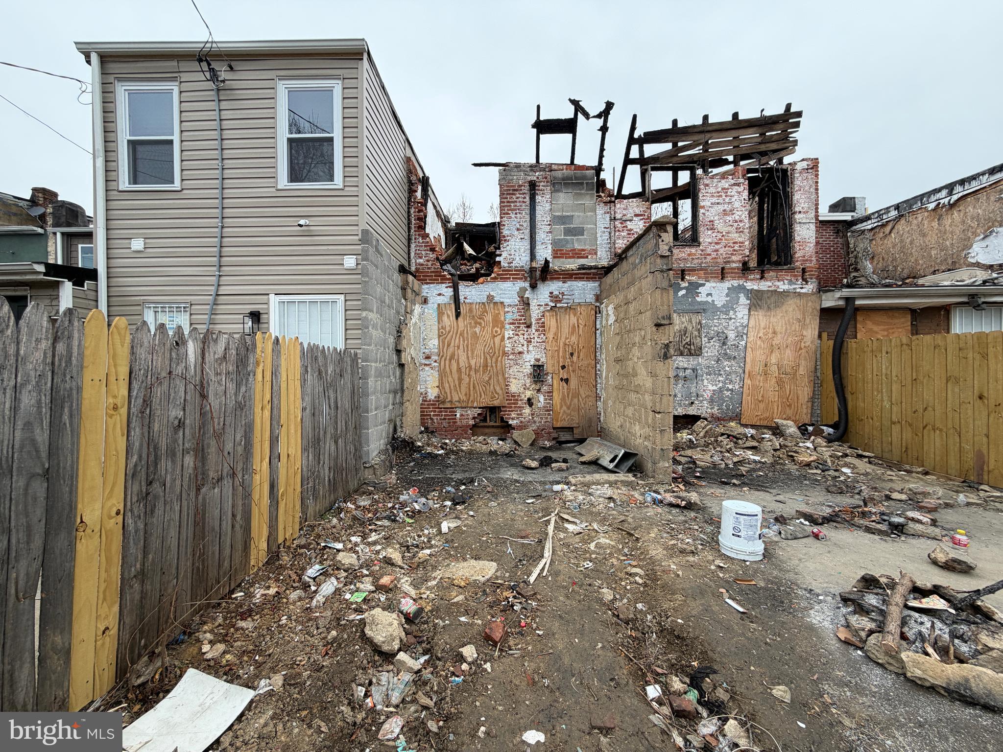 1821 Ramsay Street Baltimore, MD 21223 - Photo 5 of 6 a view of a house with wooden fence