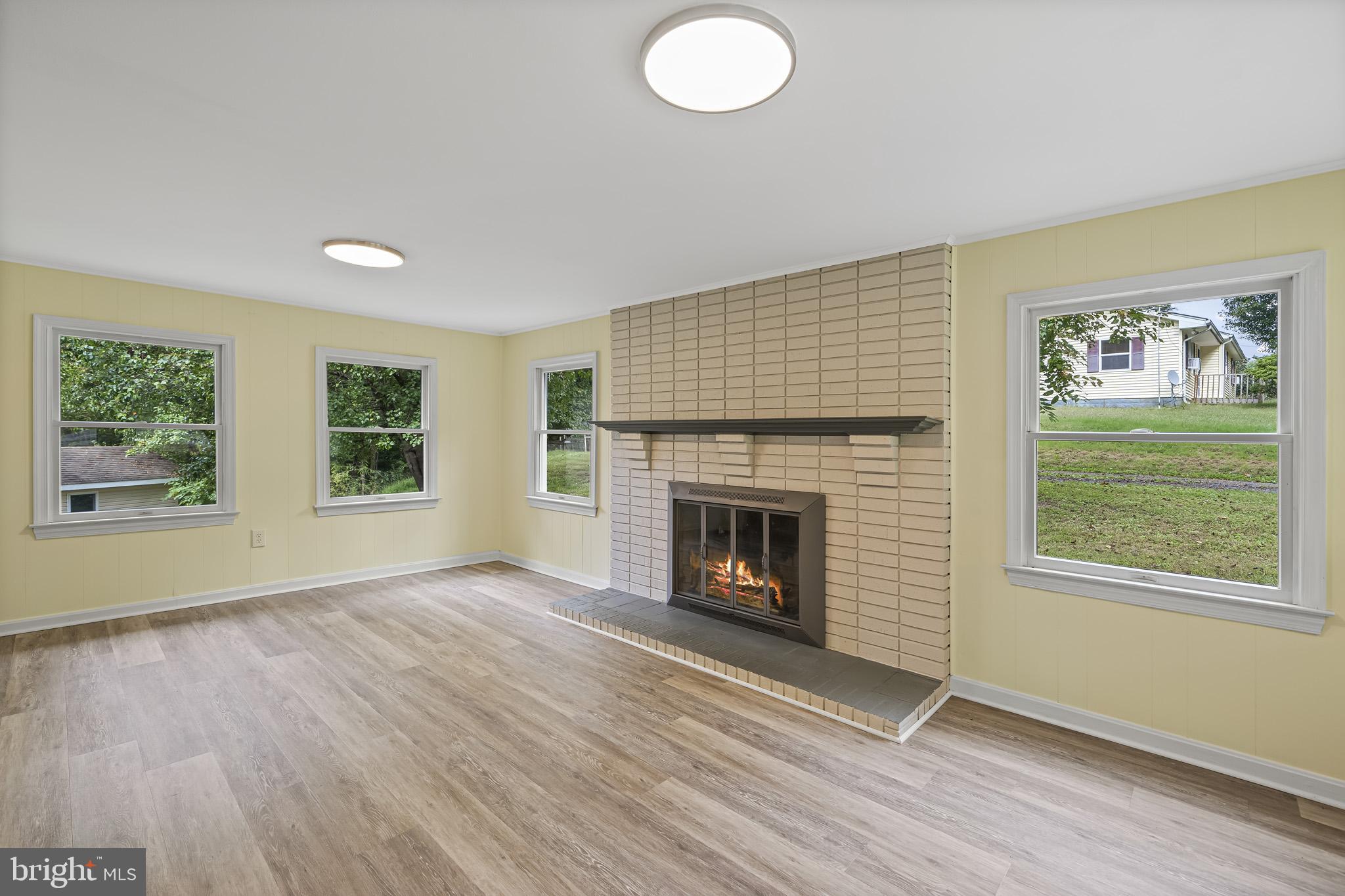 420 Clay Hammond Road Prince Frederick, MD 20678 - Photo 15 of 38 Cozy fireplace in relaxing and sunny room