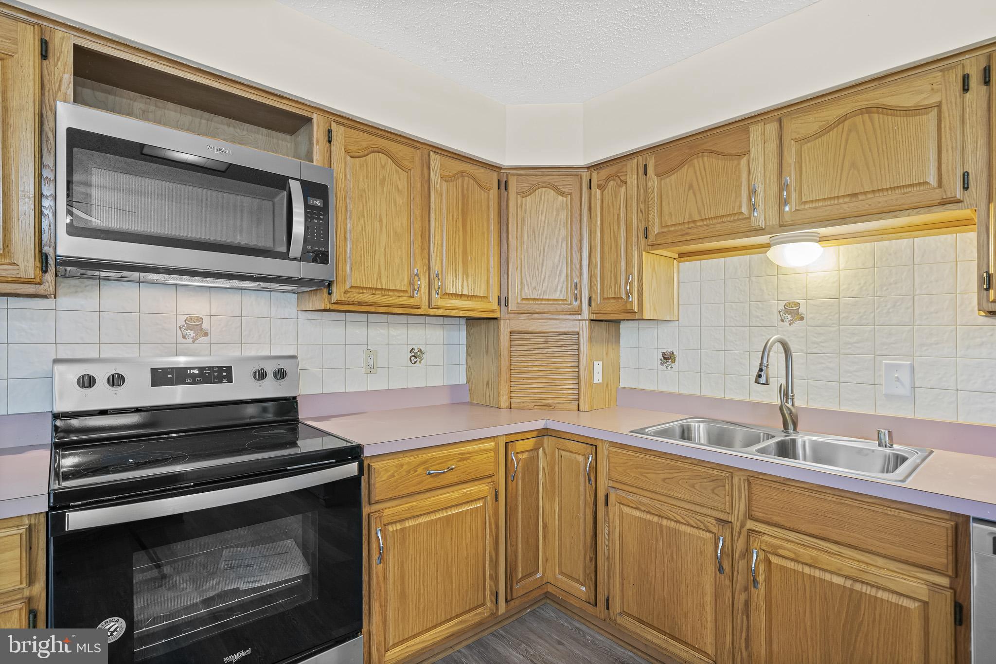 420 Clay Hammond Road Prince Frederick, MD 20678 - Photo 6 of 38 Stove and microwave