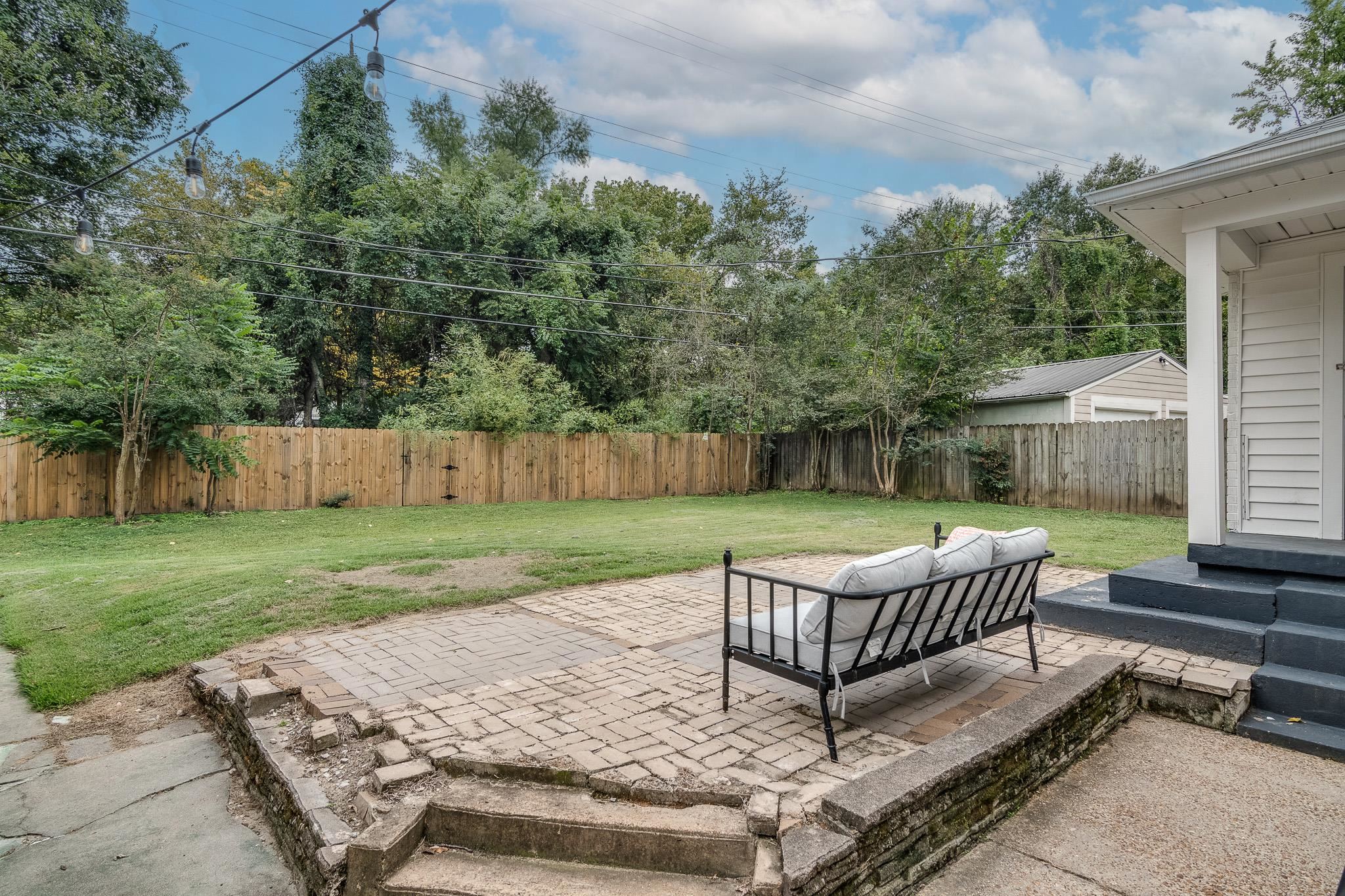 3901 Lytle Circle Memphis, TN 38122 - Photo 27 of 36 a view of a chairs and backyard with wooden fence