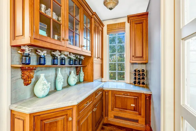 a kitchen with stainless steel appliances granite countertop a stove and a microwave