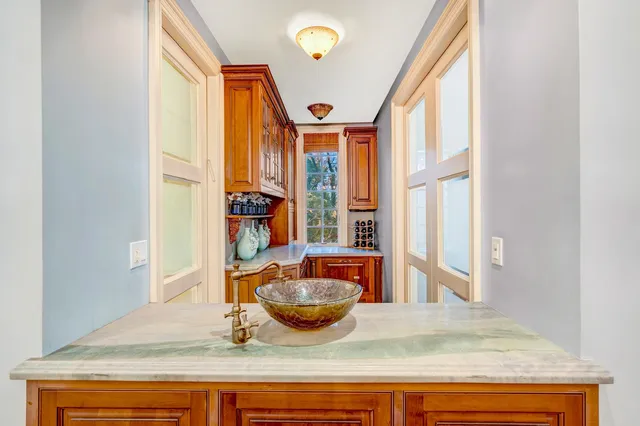 a open kitchen with stainless steel appliances granite countertop a stove and a refrigerator