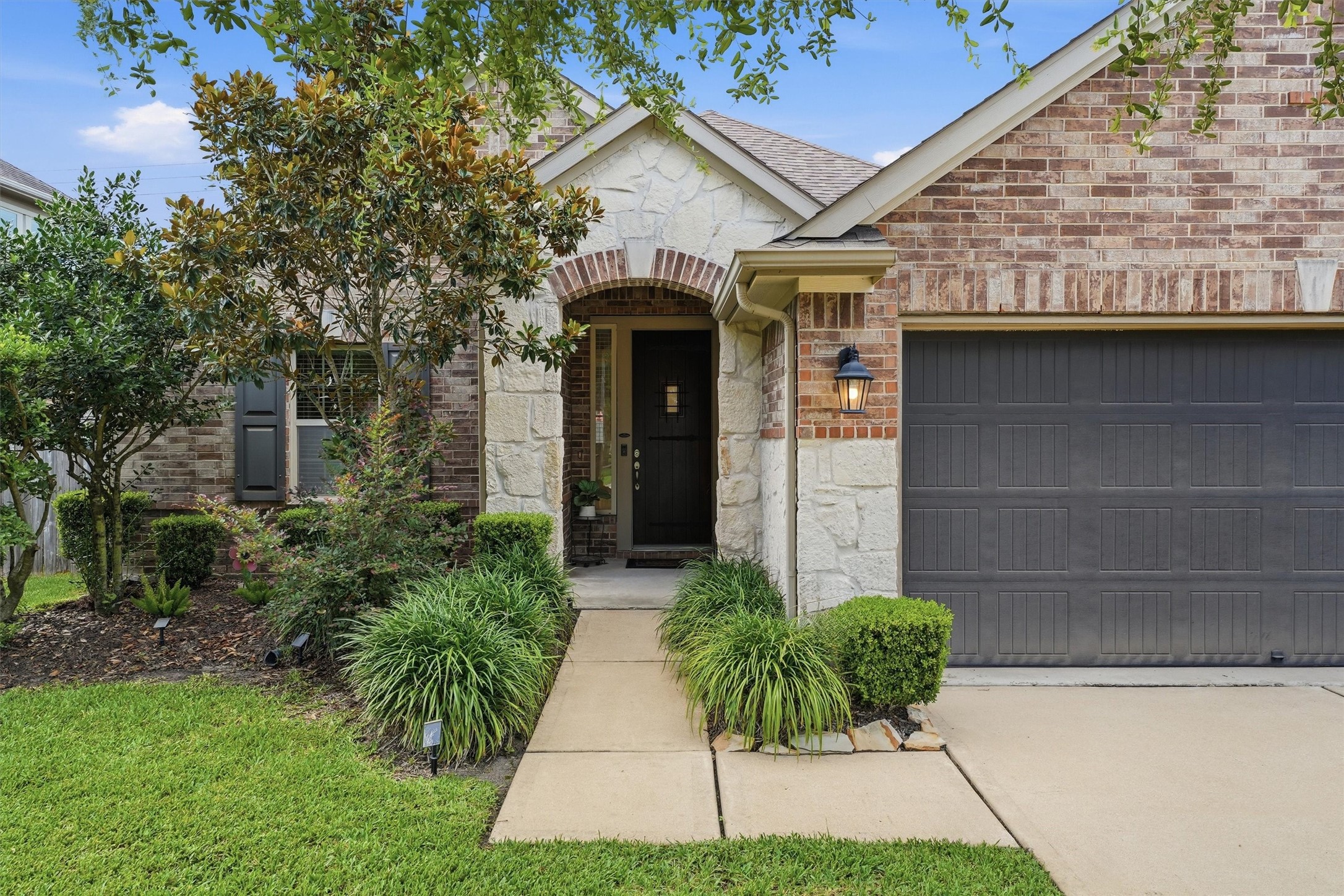 1911 Cedar Ridge Lane Pearland, TX 77089 - Photo 3 of 33 The covered front porch extends out to greet you.