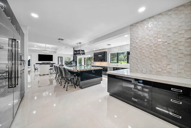 a view of a livingroom with furniture and a flat screen tv