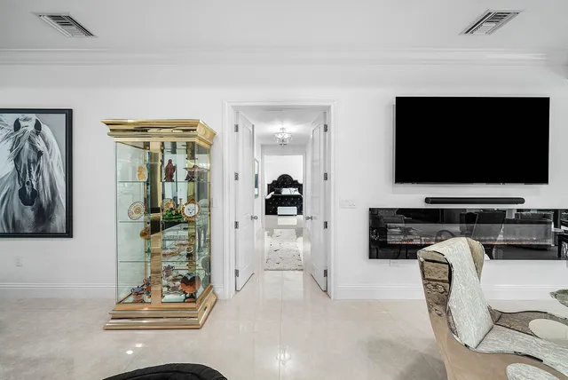 a spacious bedroom with a large bed and a large window