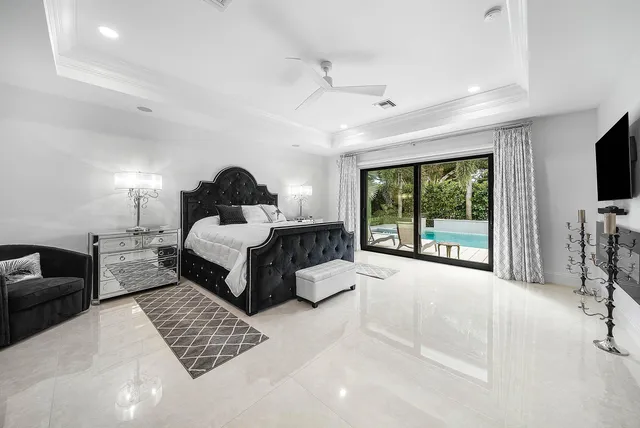a living room with hardwood floor and a flat screen tv