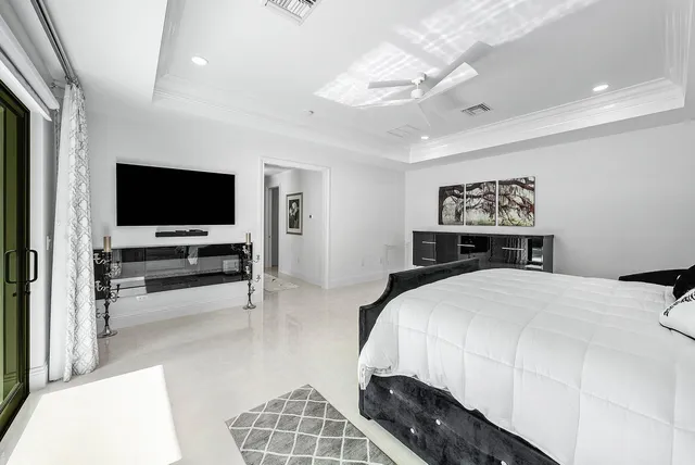 a bathroom with a granite countertop sink mirror and bathtub