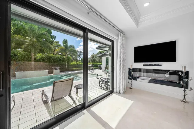 a spacious bathroom with a granite countertop sink mirror and bathtub