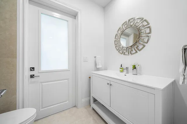 a view of a lush green field with lots of plants in it