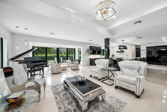 a dining room with furniture and window