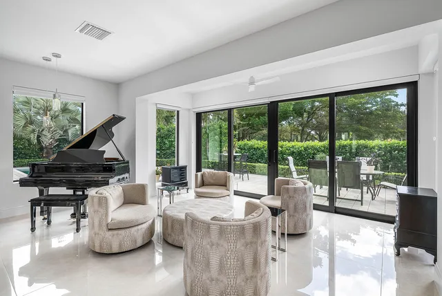 a large kitchen with stainless steel appliances granite countertop a sink and a stove