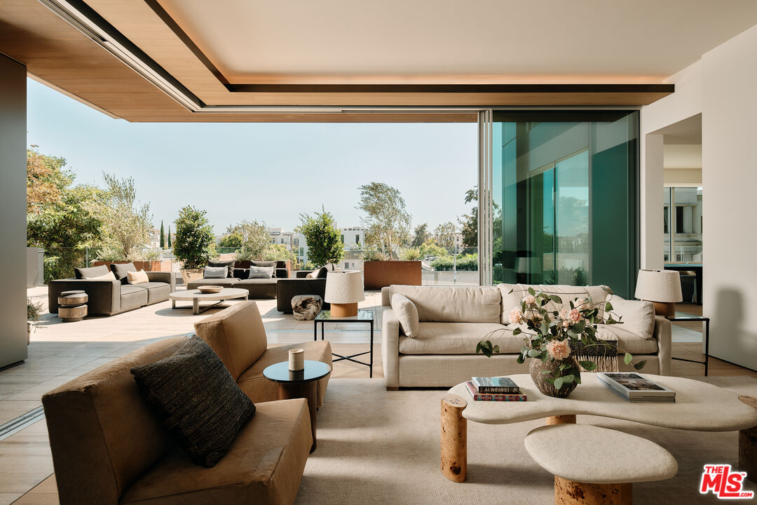 8899 Beverly Boulevard, Unit 4D Los Angeles, CA 90048 - Photo 2 of 28 a living room with furniture and a large window