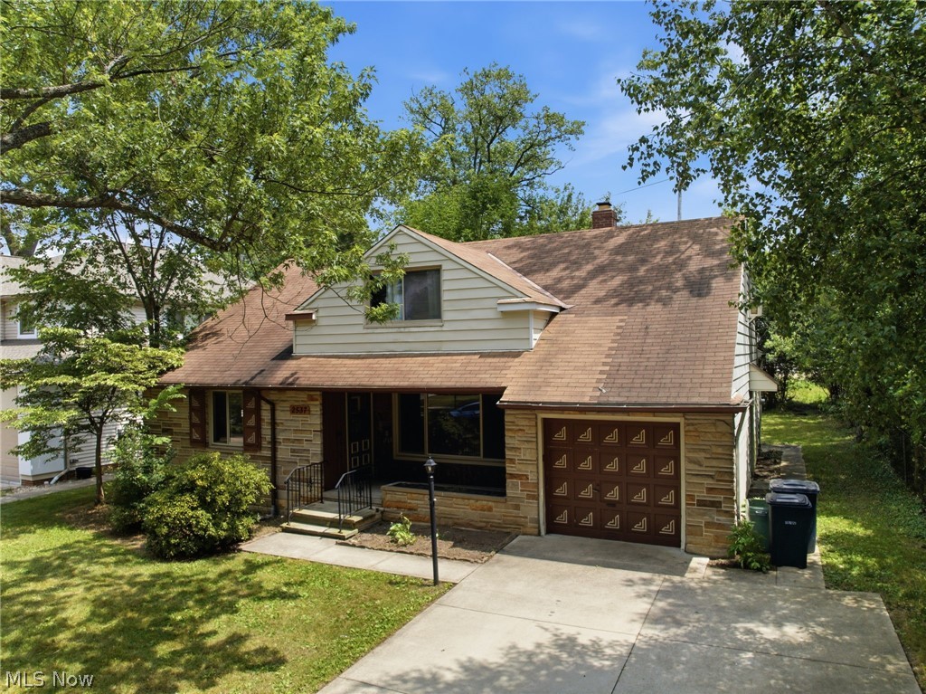 2537 Edgewood Road Beachwood, OH 44122 - Photo 3 of 39 Stone and siding exterior with a pitched roof