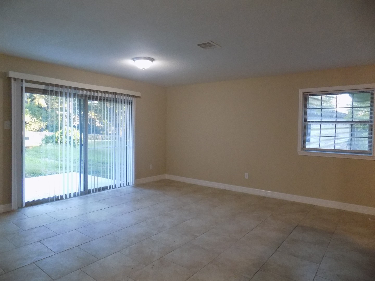 12705 Pebble Creek Lane Cypress, TX 77429 - Photo 2 of 19 a view of an empty room with wooden floor and a window