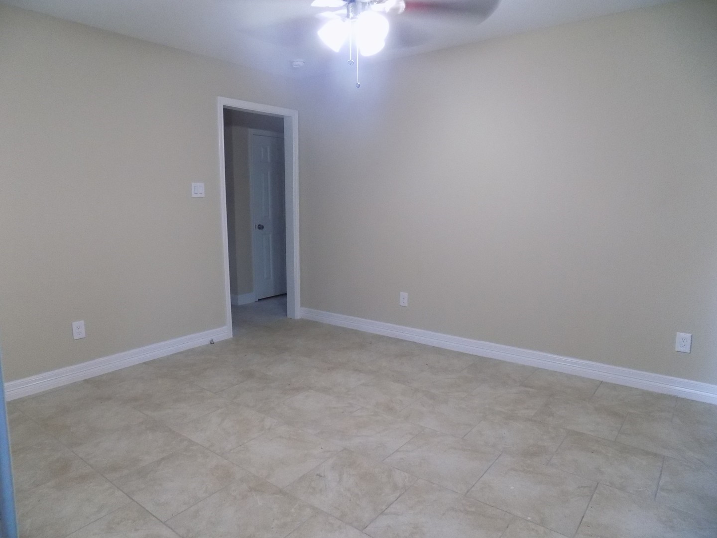 12705 Pebble Creek Lane Cypress, TX 77429 - Photo 6 of 19 an empty room with a fan & a window