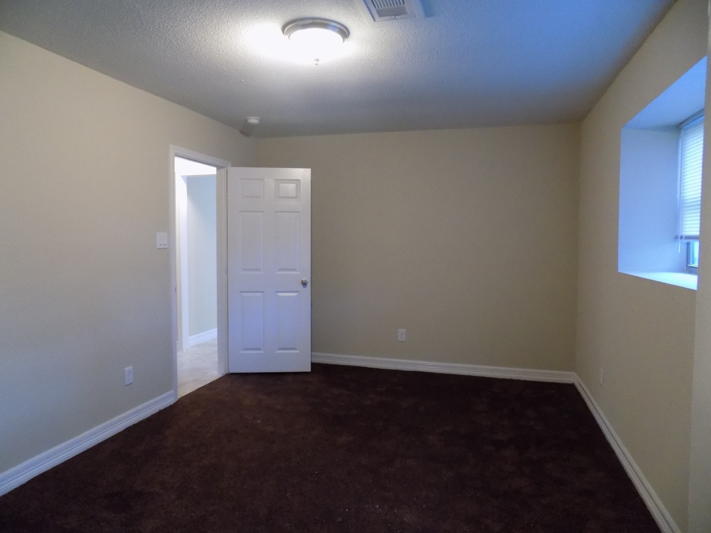 12705 Pebble Creek Lane Cypress, TX 77429 - Photo 7 of 19 an empty room with wooden floor and windows