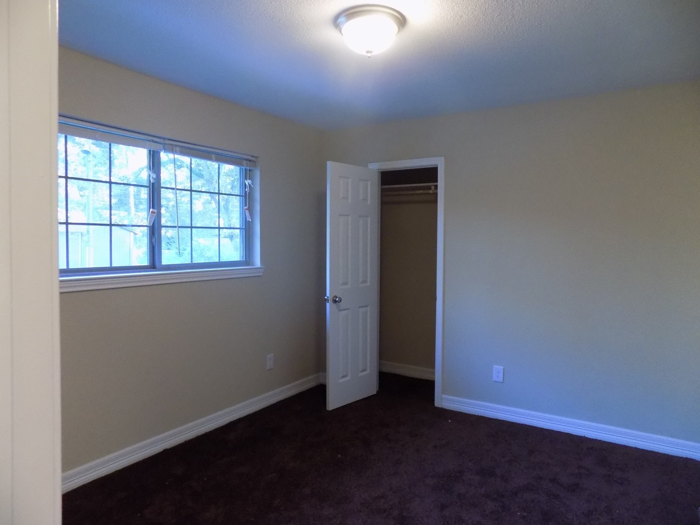 12705 Pebble Creek Lane Cypress, TX 77429 - Photo 8 of 19 an empty room with wooden floor and windows