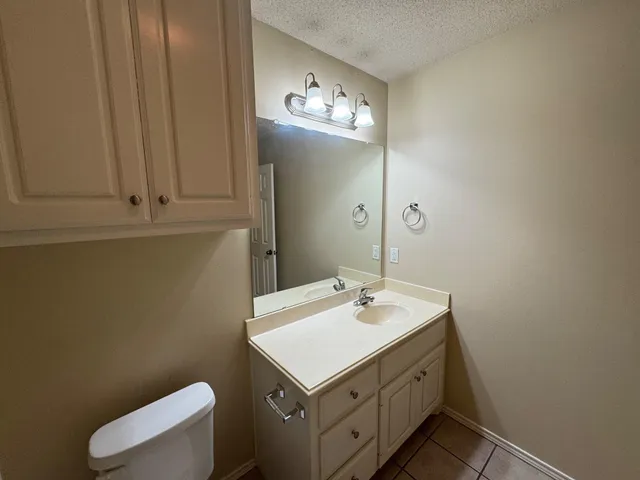 a bathroom with a toilet and a bathtub