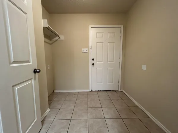 a view of a bathroom with white walls