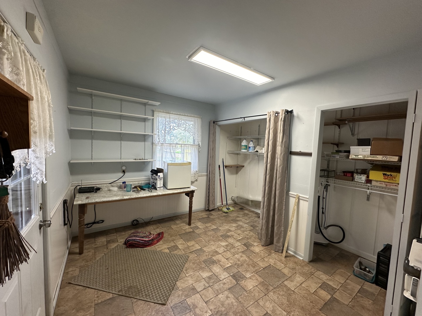 10015 Stichter Street Fenton, IL 61251 - Photo 13 of 35 a room with a couch and a refrigerator