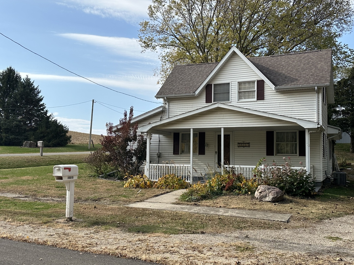 10015 Stichter Street Fenton, IL 61251 - Photo 2 of 35 a front view of a house with garden
