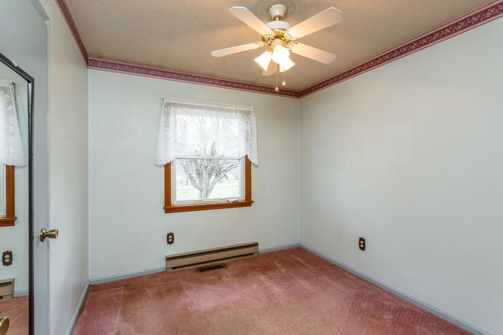 10807 Indian Trail Road Harrisonburg, VA 22802 - Photo 11 of 32 an empty room with windows and fan