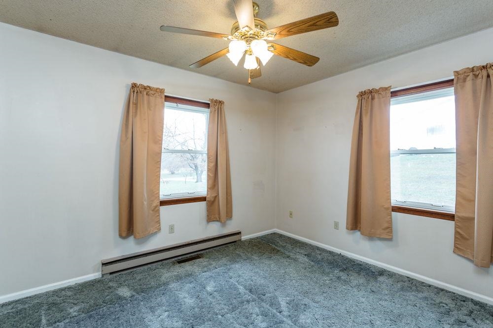 10807 Indian Trail Road Harrisonburg, VA 22802 - Photo 12 of 32 an empty room with windows and fan