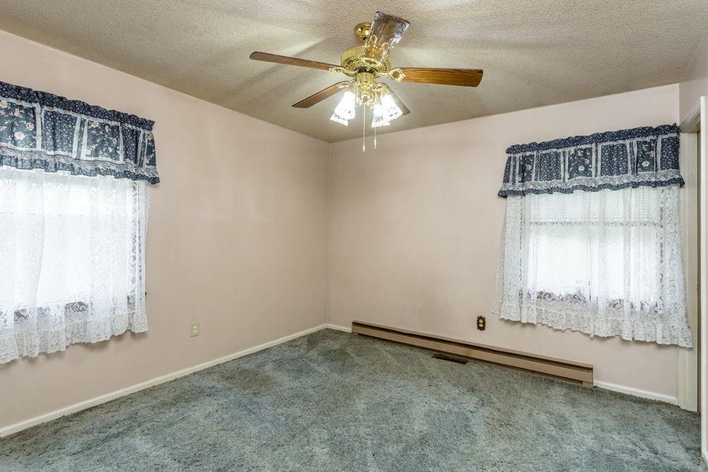 10807 Indian Trail Road Harrisonburg, VA 22802 - Photo 13 of 32 wooden floor in an empty room with a window
