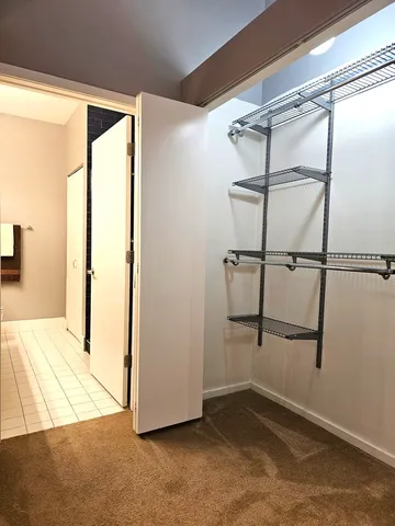 a bathroom with a sink a large mirror and a toilet