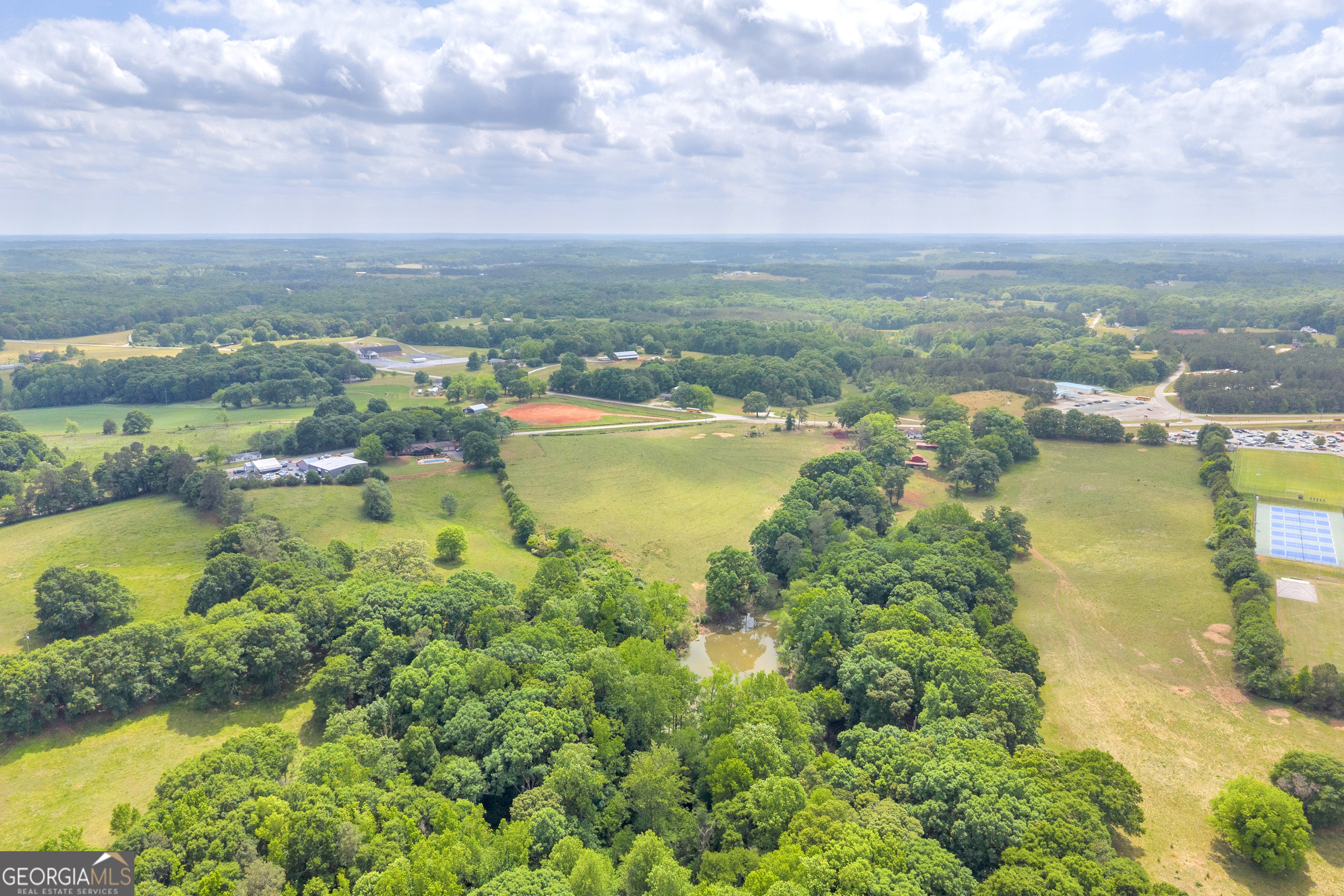 6490 Highway 145 Carnesville, GA 30521 - Photo 11 of 29 an aerial view of residential houses with outdoor space and lake view in back
