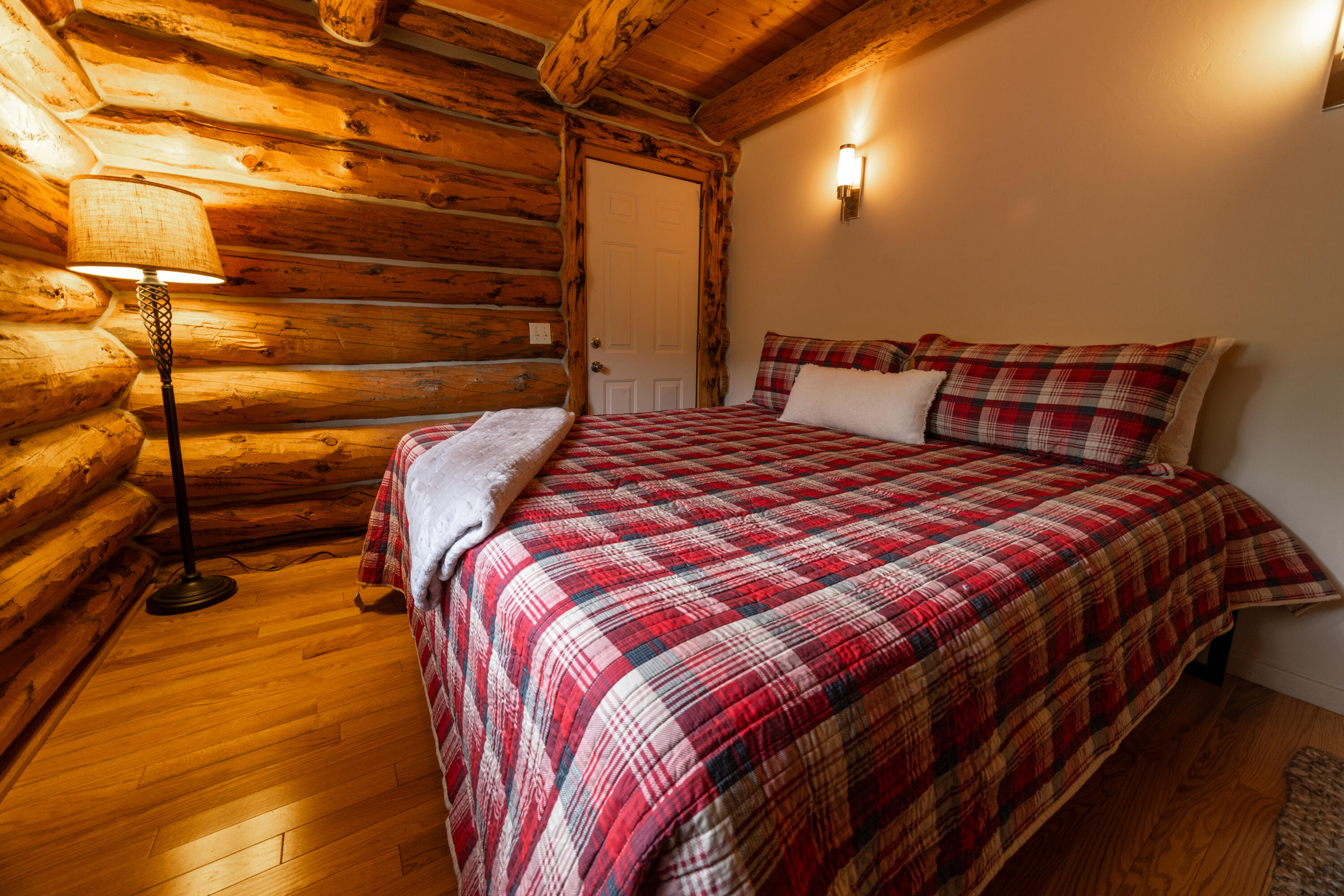 2001 County Road Placerville, CO 81430 - Photo 23 of 37 a bed sitting in a bedroom next to a window