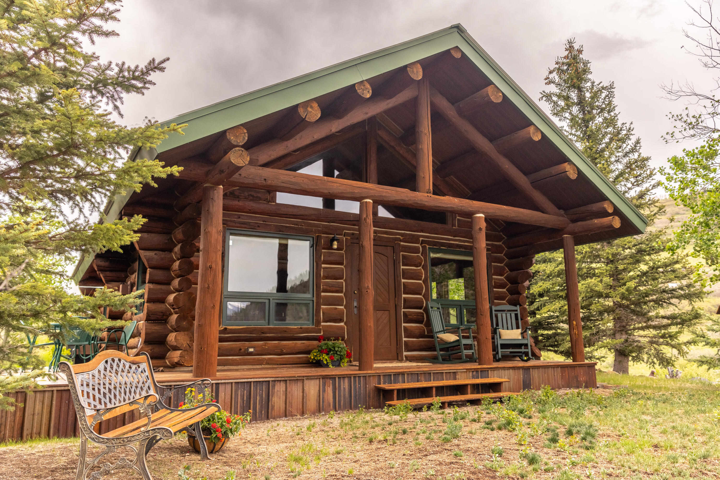 2001 County Road Placerville, CO 81430 - Photo 7 of 37 a view of a house with wooden floor next to a yard