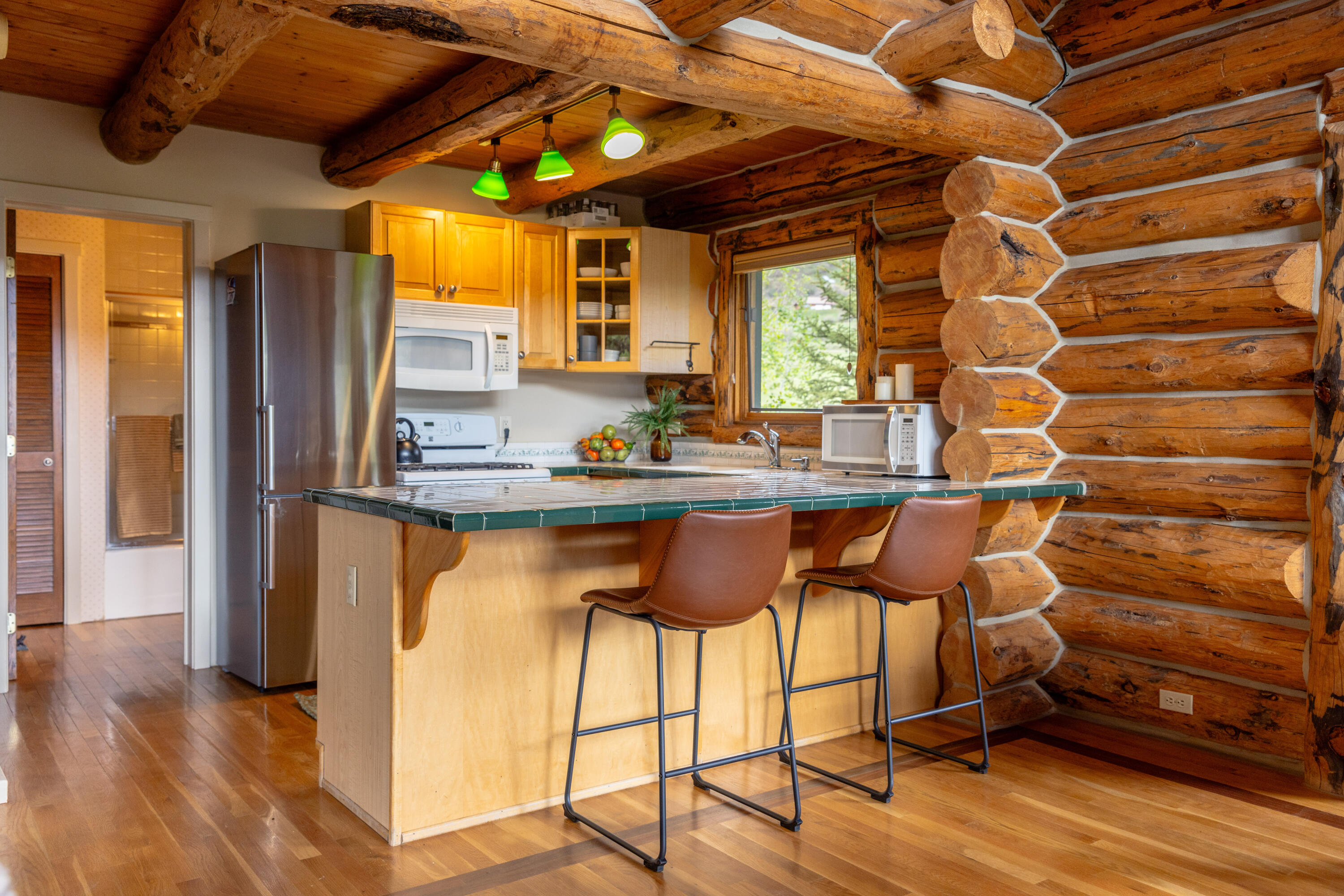 2001 County Road Placerville, CO 81430 - Photo 9 of 37 a kitchen with stainless steel appliances granite countertop a sink and a refrigerator