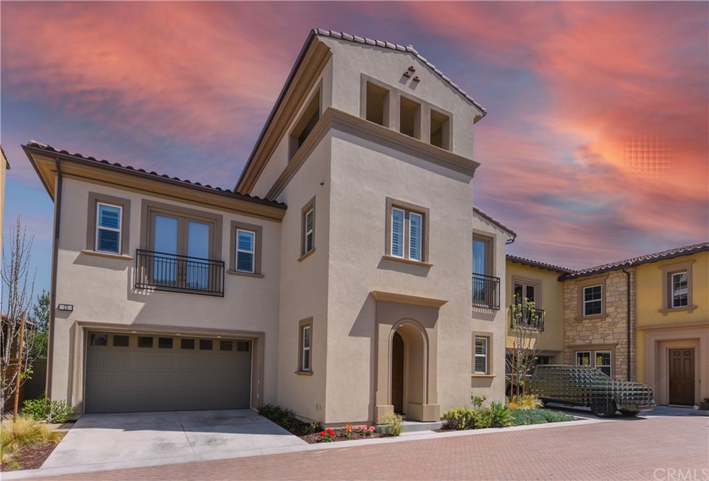 a front view of a house with a garage