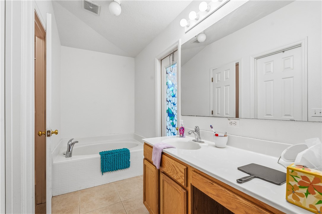 131 Bellamy Trail Sebastian, FL 32958 - Photo 19 of 32 a bathroom with a sink and a mirror
