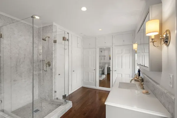 a bathroom with a shower and a sink