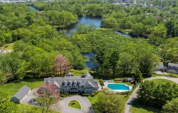 a view of a backyard with swimming pool