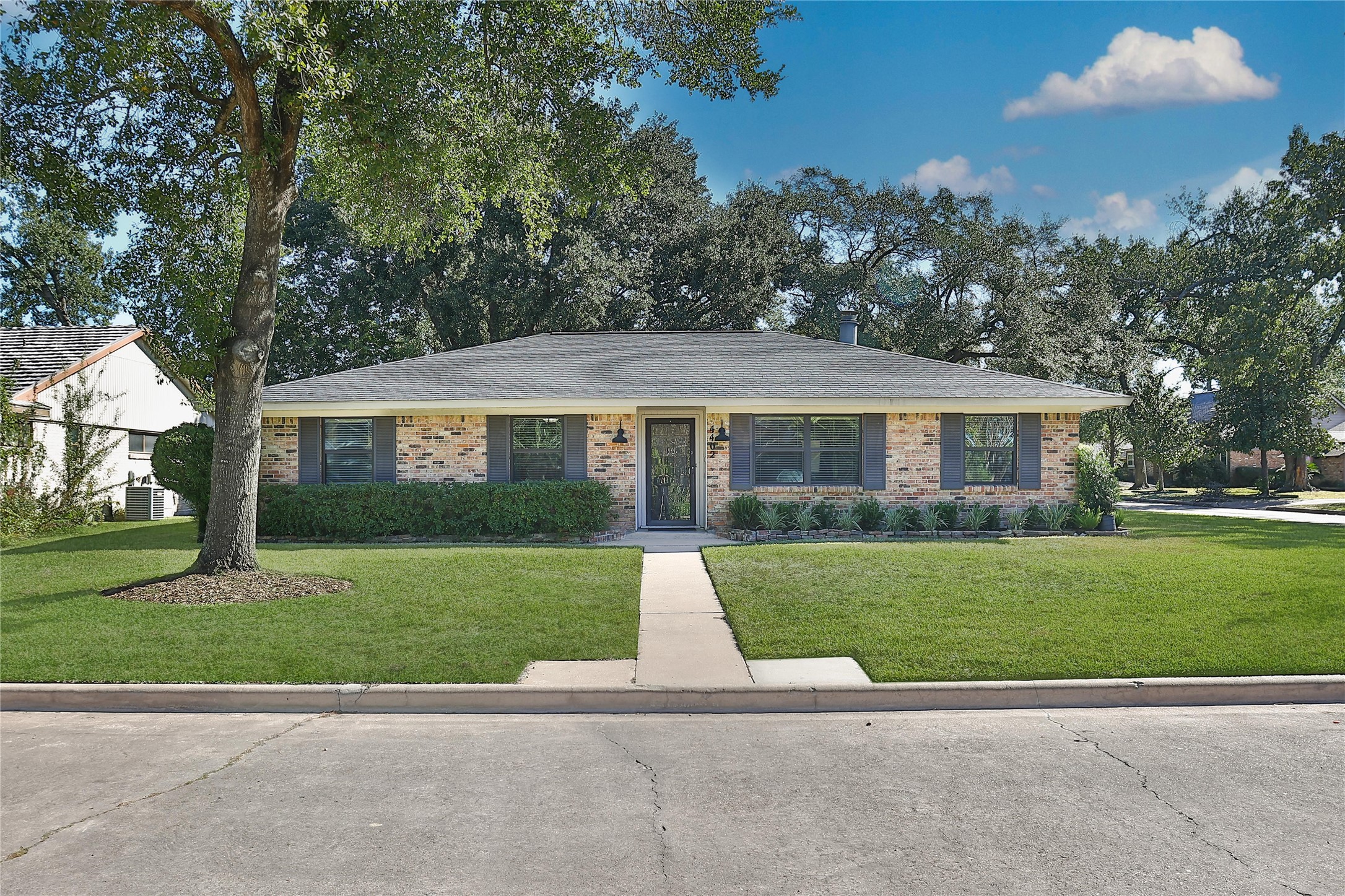 4402 Fallbrook Drive Houston, TX 77018 - Photo 2 of 29 Crisp exterior with updated landscaping, fresh paint, and a welcoming front elevation on a quiet corner lot.