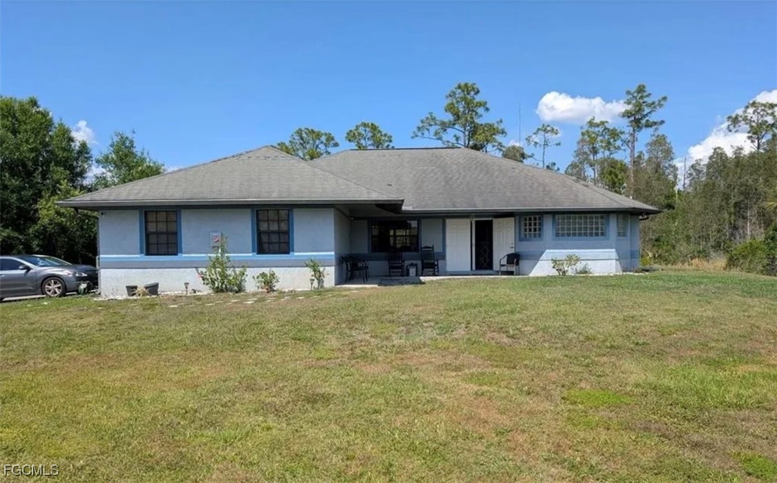 a front view of a house with a garden and porch