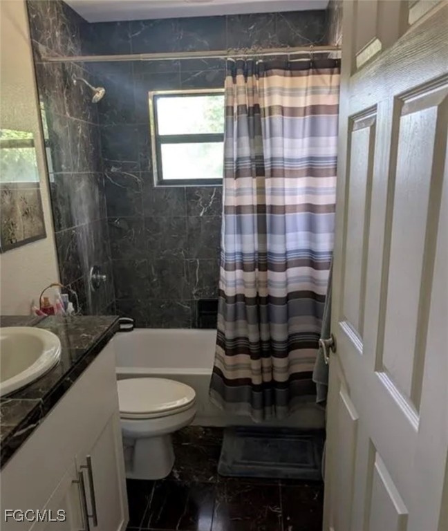 41300 Horseshoe Road Punta Gorda, FL 33982 - Photo 13 of 14 a bathroom with a sink a toilet and shower