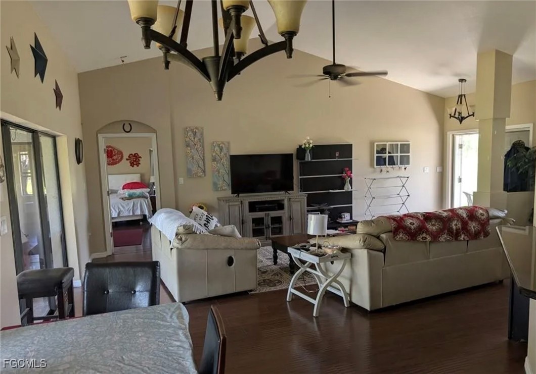 41300 Horseshoe Road Punta Gorda, FL 33982 - Photo 2 of 14 a living room with furniture a flat screen tv and a fireplace