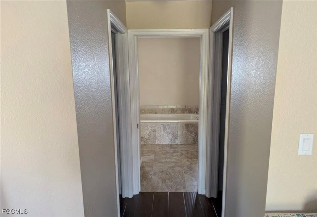 41300 Horseshoe Road Punta Gorda, FL 33982 - Photo 10 of 14 a bathroom with a glass shower door