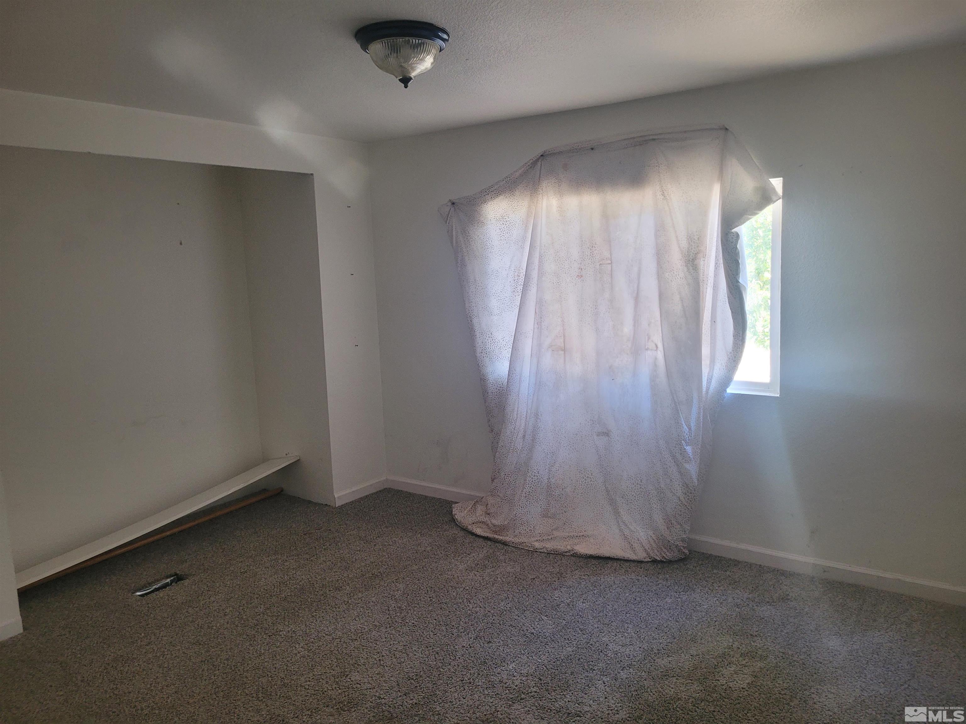 17820 Mockingbird Drive Reno, NV 89508 - Photo 9 of 14 an empty room with windows