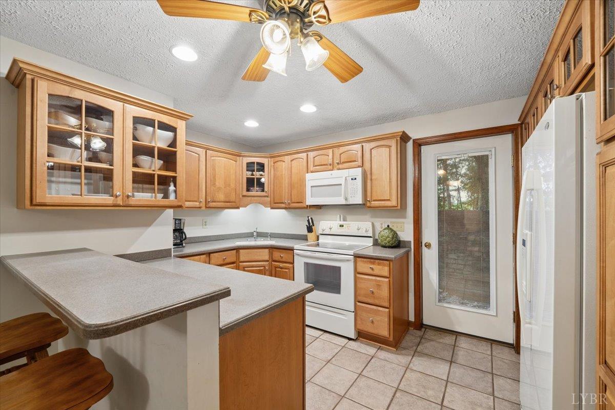 3289 Peaks Road Bedford, VA 24523 - Photo 55 of 71 a kitchen with a stove a sink dishwasher and a refrigerator