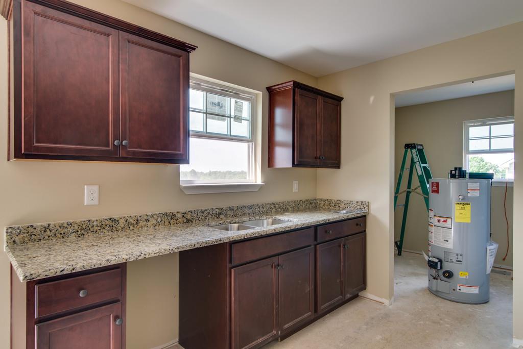 590 Murrell Road Dickson, TN 37055 - Photo 14 of 25 a kitchen with a sink a counter space and cabinets