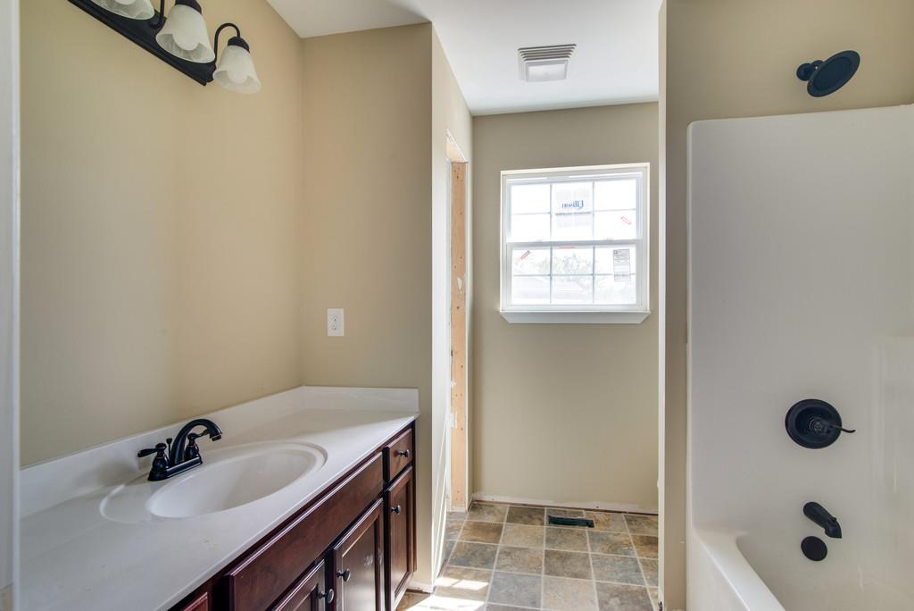 590 Murrell Road Dickson, TN 37055 - Photo 19 of 25 a bathroom with a sink a toilet and shower
